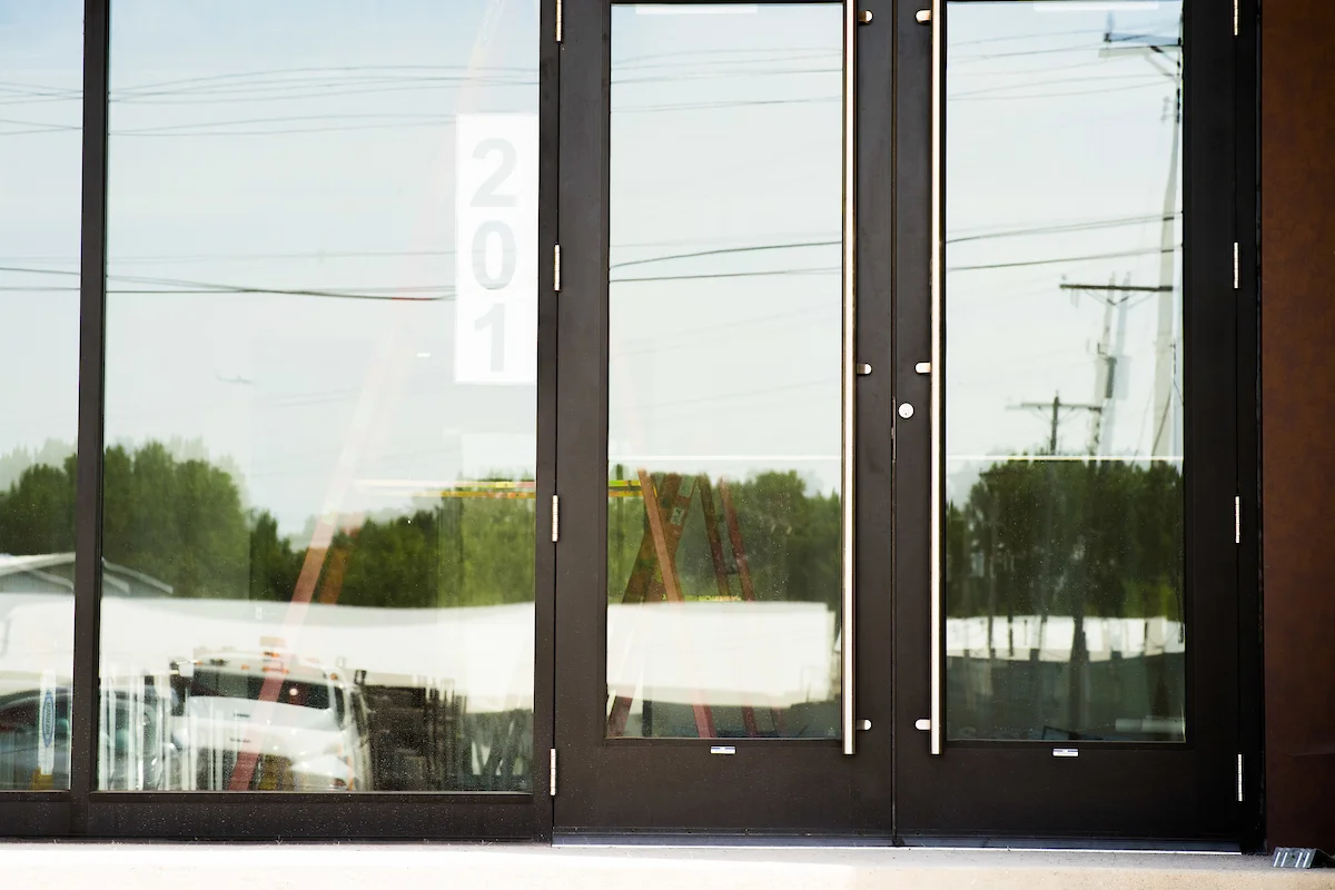 Residential glass entry doors with sidelight panels after polishing